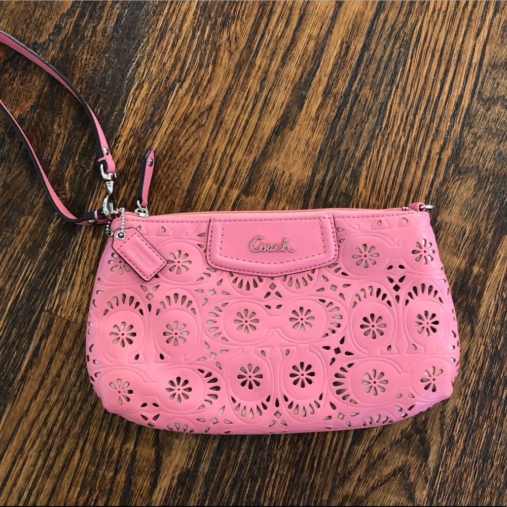 Coach eyelet leather wristlet in pink